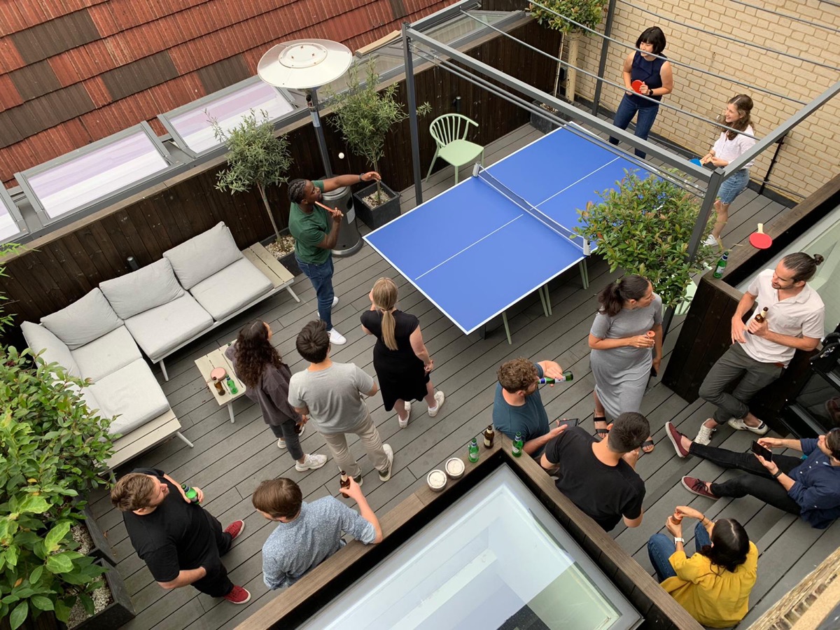 Table tennis on the studio roof terrace at a summer social